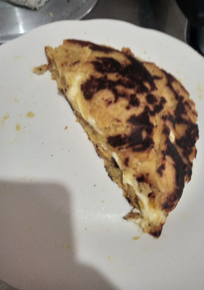 Una foto de Arepa de plátano rellena de quesos