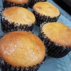 A picture of 12 Vanilla cup cakes.