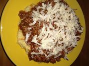 Una foto de polenta con tuco