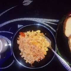 A picture of Scrambled eggs and ugali.