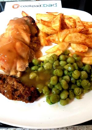 A picture of My Stuffed Peppered Chicken breast with Homemade Chips + Peas.