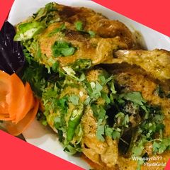 A picture of Whosayna’s Chicken Tikka topped with Coconut Cream.