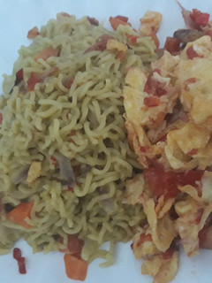 A picture of Noddles with fried egg.