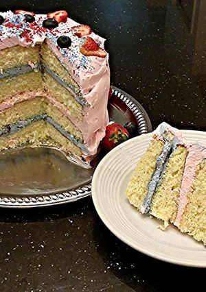 A picture of White Butter Cake with Strawberry and Blueberry Whipped Cream.
