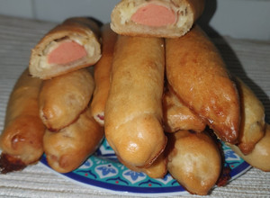 Una foto de Salchichas envueltas en masa fina.
