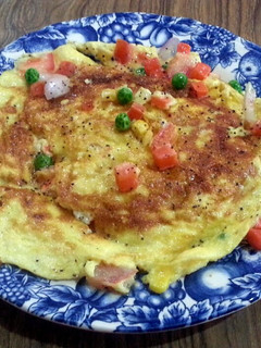A picture of Crab meat and mixed vege omelette.