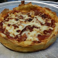A picture of Iz's Chicago Style Deep Dish Pizza.