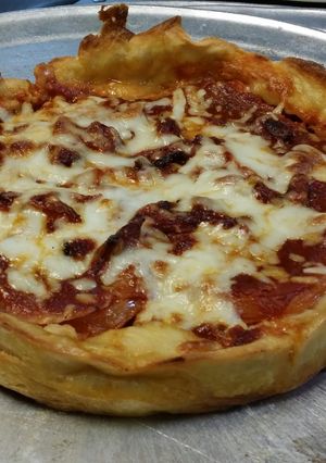 A picture of Iz's Chicago Style Deep Dish Pizza.
