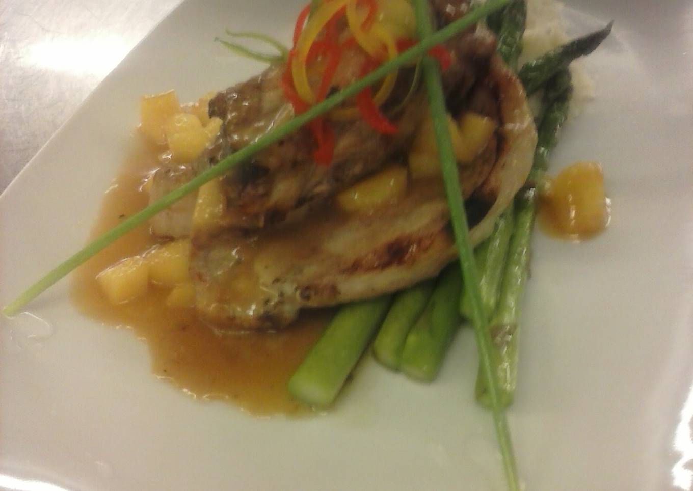 Brined pork chop with captain morgan apple demiglaze mashed potatoes and asparagus