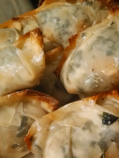 A picture of Shrimp, spinach and cream cheese ragoons.