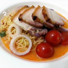 A picture of Tom Yum Instant Noodle With Roasted Pork Slice.