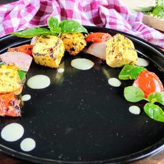 A picture of Paneer Tikka with Italian mix spice and Pesto yogurt dip.