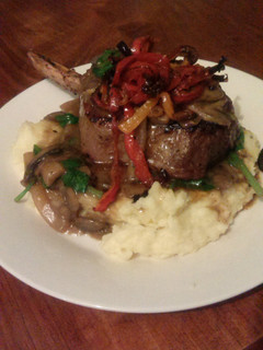 A picture of Steak with mushroom and spinach sauce..