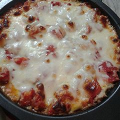 Cheesy, tomato ,and rice with a little meat pie A picture of Cheesy, tomato ,and rice with a little meat pie.