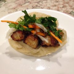A picture of Siu Yuk Bao (Roasted pork belly sandwich).