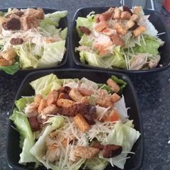 A picture of Chicken ceasar salad.