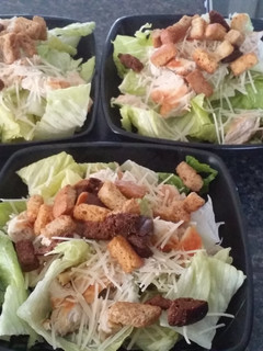 A picture of Chicken ceasar salad.