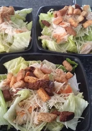 A picture of Chicken ceasar salad.