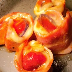 A picture of Bacon Wrapped Egg Plant and Cheese.