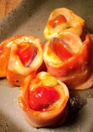 A picture of Bacon Wrapped Egg Plant and Cheese.