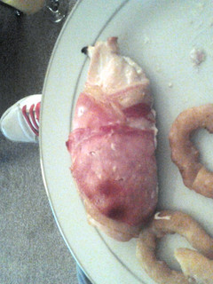 A picture of garlic chicken wrapped in bacon.