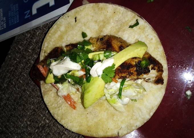 Fish taco with spicy cilantro lime sauce