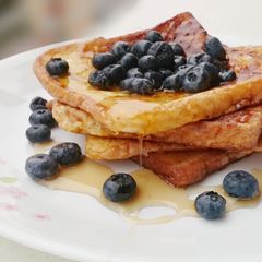 A picture of French Toast With Maple Syrup And Blueberries.