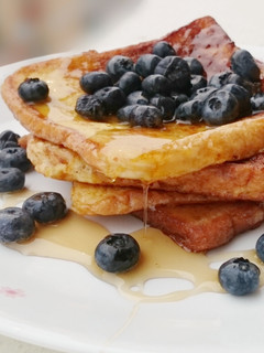 A picture of French Toast With Maple Syrup And Blueberries.