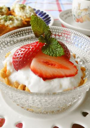 A picture of Granola with Strawberry Honey Yogurt.