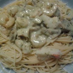 A picture of Shrimp and crab pesto pasta.