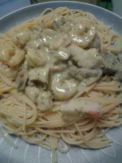 A picture of Shrimp and crab pesto pasta.