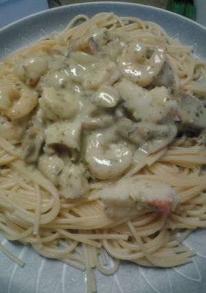 A picture of Shrimp and crab pesto pasta.