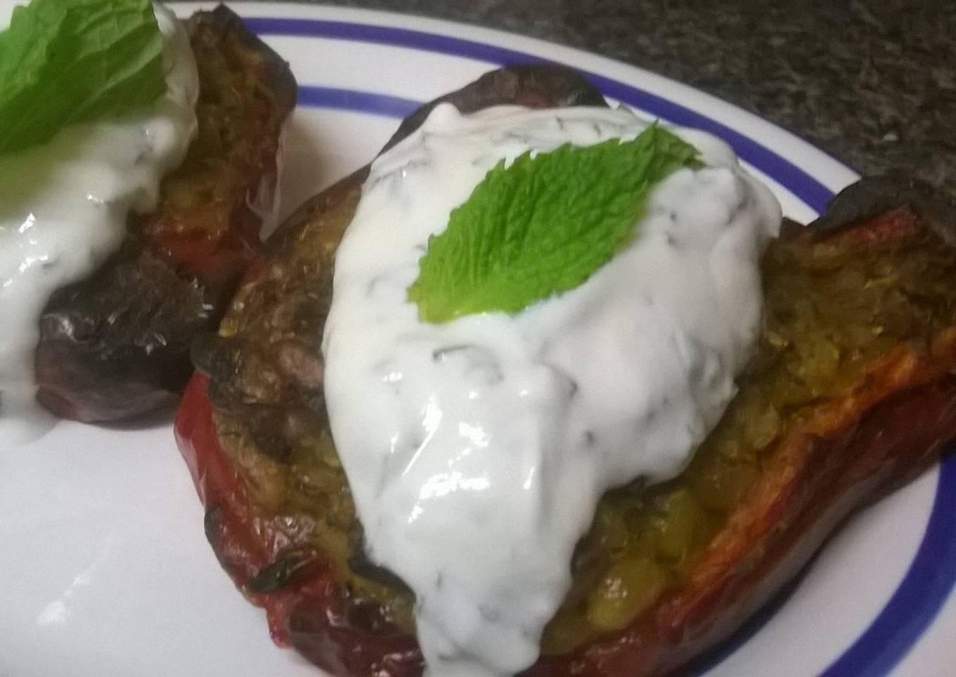 Rice stuffed peppers with mint yogurt sauce