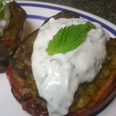 Rice stuffed peppers with mint yogurt sauce A picture of Rice stuffed peppers with mint yogurt sauce.