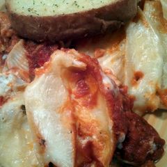 A picture of Stuffed shells with two sauces.