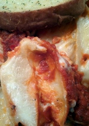 A picture of Stuffed shells with two sauces.