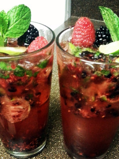 A picture of mixed berry mojitos.