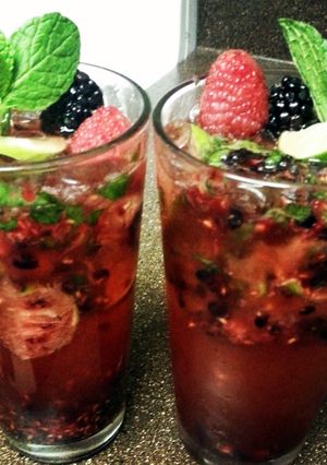 A picture of mixed berry mojitos.