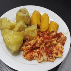 A picture of Boiled plantain and potatoes with egg sauce.
