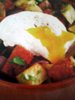 A picture of Chorizo Hash with Poached Eggs.