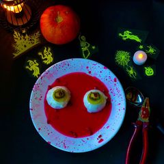 A picture of Coconut milk pudding with pomegranate juice.