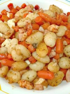 Una foto de Ñoquis salteados con gambas al pilpil