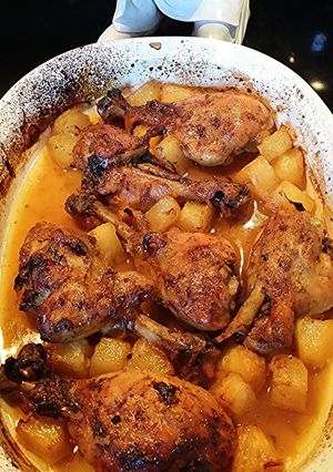 A picture of baked chicken with pineapple.