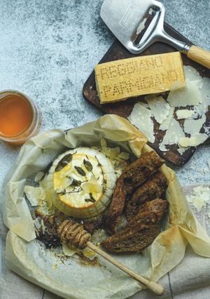 A picture of Baked Ricotta with Fresh Herbs, Honey and Parmigiano Reggiano PDO.