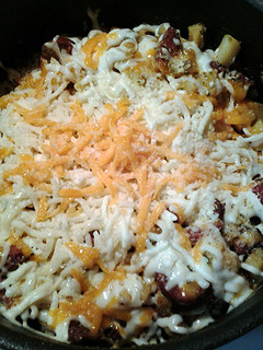 A picture of Cheesy potatoes with sausage and bacon.