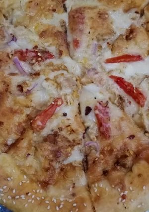 A picture of Chicken tikka corner pizza 🍕🍕.