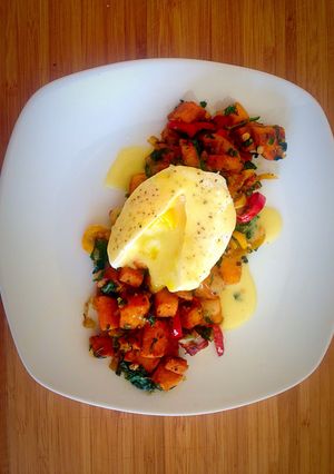 A picture of Poached Egg with Hollandaise Sauce and Sweet Potato Spinach Hash.