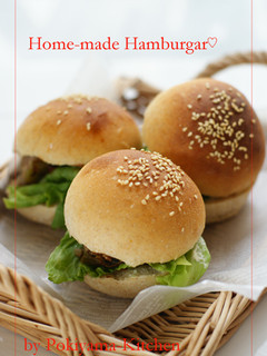 A picture of Homemade Hamburgers With Handmade Buns.
