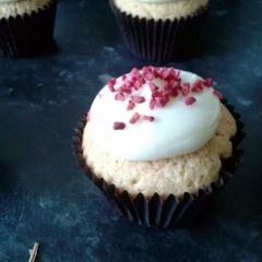 A picture of rose and raspberry cream cheese cupcakes.