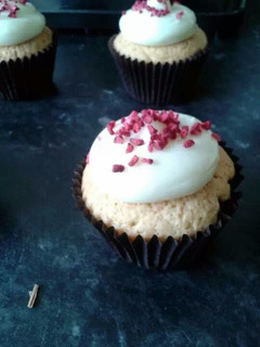 A picture of rose and raspberry cream cheese cupcakes.
